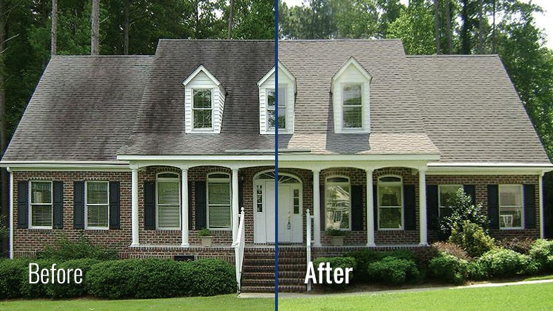 Brick home with black streaks removed from roof